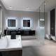 interiors shots of a modern bathroom in the foreground the bathtub in the background the washbasin furniture and the toilet bowl and bidetand